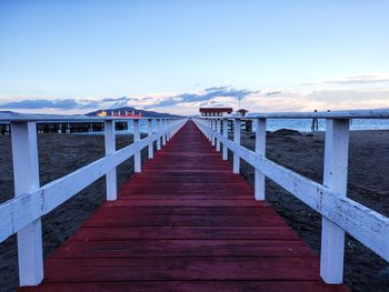 Pier over sea against sky