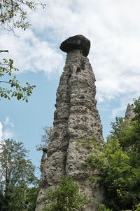 Low angle view of statue against sky