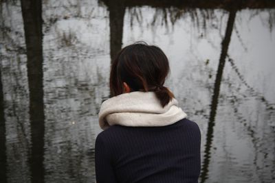 Woman against lake in forest