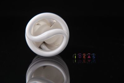 Energy efficient bulb by ideas text against black background