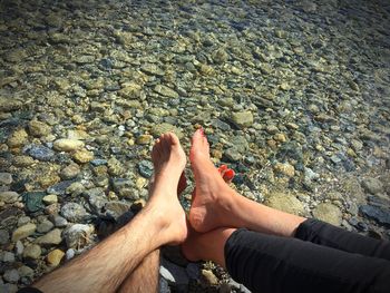 Low section of couple at beach