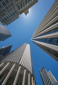 Low angle view of modern buildings against clear sky