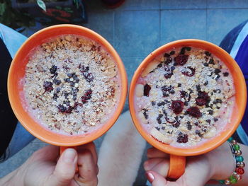 Close-up of hand holding tea cup