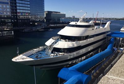 Ship moored at harbor in city