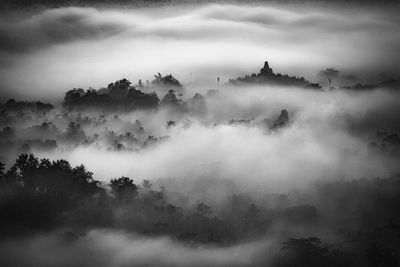 Scenic view of mountain against cloudy sky