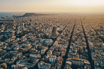 View of cityscape against sky during sunrise