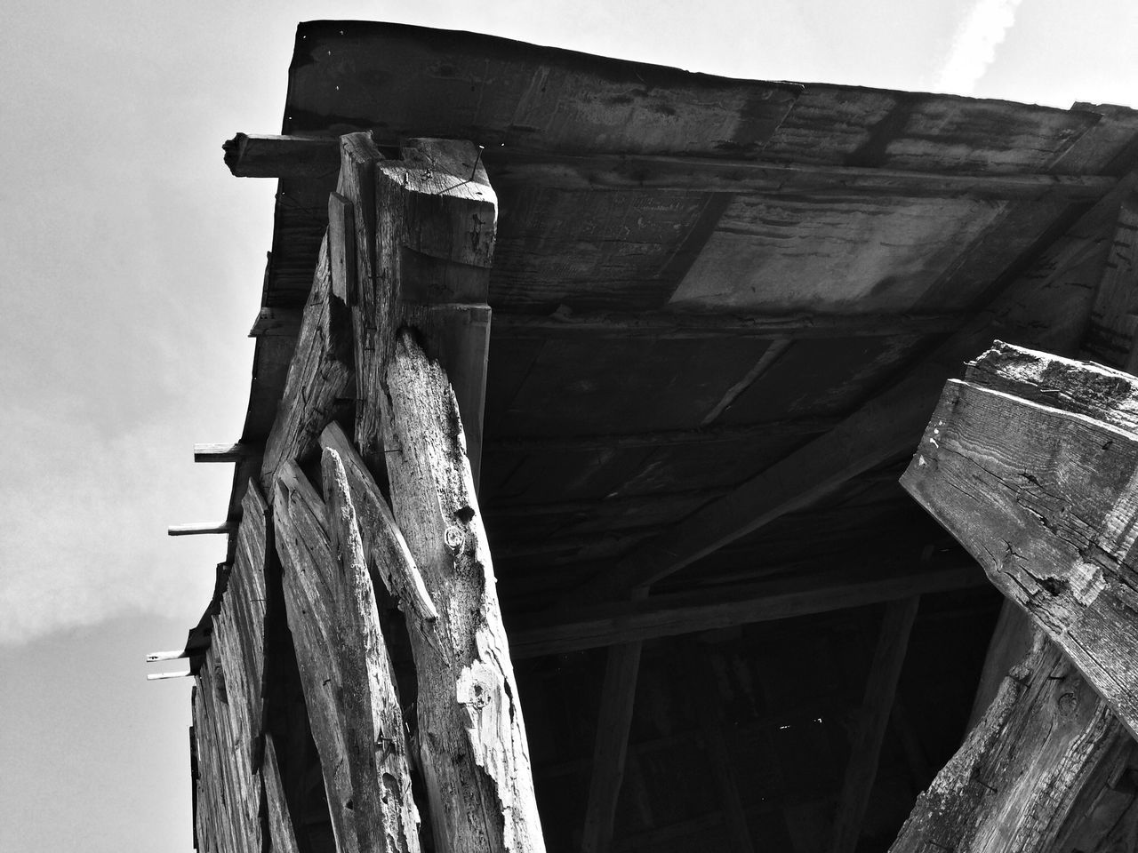 architecture, built structure, building exterior, old, damaged, low angle view, abandoned, sky, wood - material, run-down, obsolete, weathered, deterioration, old ruin, ruined, destruction, day, wooden, outdoors, history
