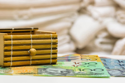 Close-up of paper currencies with box