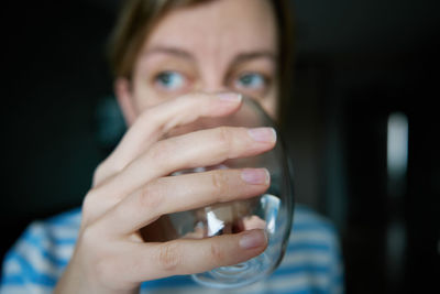 Close-up of woman drinking glass