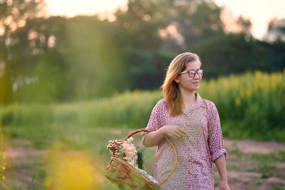 Portrait of woman walking in the rural field