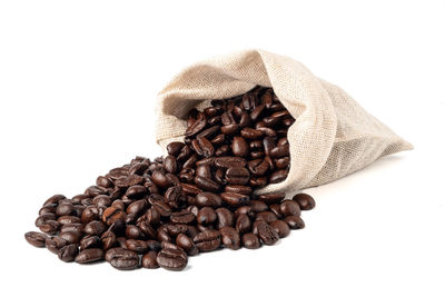 Close-up of coffee beans against white background