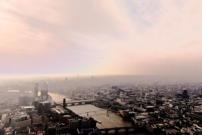 High angle view of city buildings during sunset