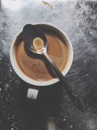 High angle view of coffee cup on table