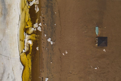 Aerial view of lifeguard hut at beach during winter