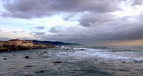 Scenic view of sea against cloudy sky