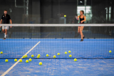 Play padel on indoor tennis court