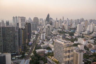 High angle view of modern buildings in city against sky