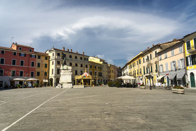 Buildings in city against sky