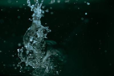 Close-up of splashing water against black background