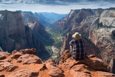 Rear view of man looking at mountains