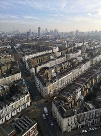 High angle view of buildings in city against sky