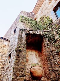 Low angle view of old building against clear sky