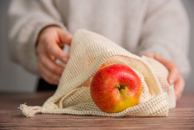 Close-up of woman holding apple