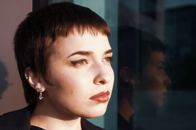 Close-up portrait of woman looking away