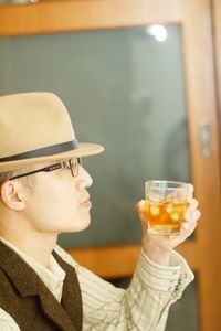 Side view of woman drinking glass