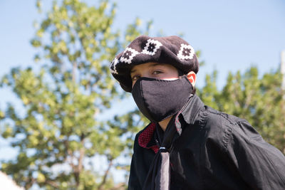 South american boy wearing face mask