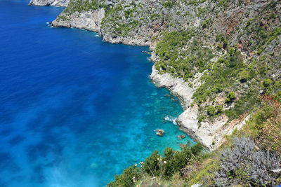 High angle view of rocks by sea