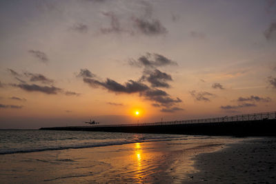 View of beach at sunset