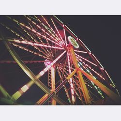 Low angle view of illuminated ferris wheel