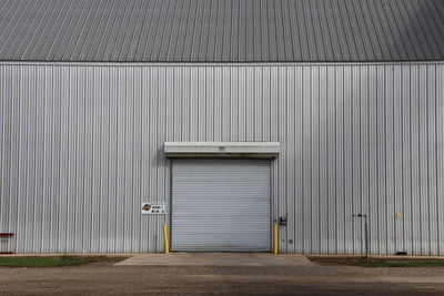 Closed industrial building on field