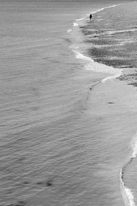 Silhouette person walking at beach