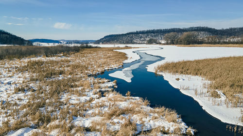 Open water as ice melts from warm sun through the valley.