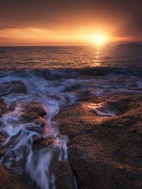 Scenic view of sea against sky during sunset