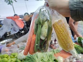 Close-up of person preparing food for sale at market
