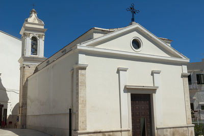 Low angle view of white building against sky