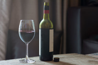 Close-up of wine glasses on table