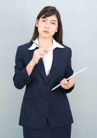 Portrait of a beautiful young woman over white background