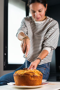 Midsection of woman holding food