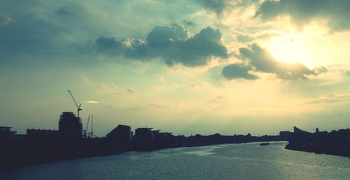 Buildings in city at sunset