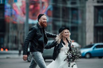 Young couple on street in city