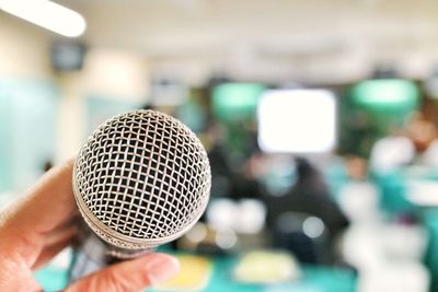 Close-up of person holding camera