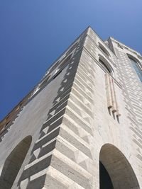 Low angle view of castle against clear blue sky