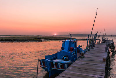 Scenic view of sea against orange sky