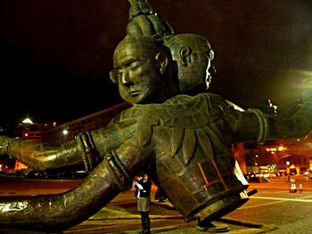 Low angle view of statue at night