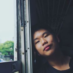 Portrait of mid adult man seen through train window