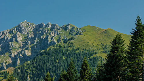 Scenic view of mountains against clear blue sky